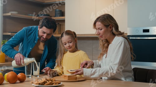 Preview: Caucasian happy family at kitchen morning breakfast with food delivery service parents mother father