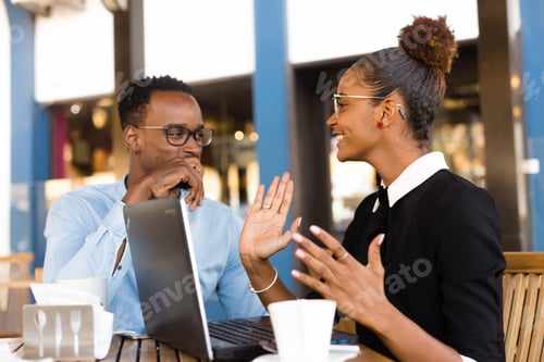 Preview: Black African American coworkers doing digital teamwork arround