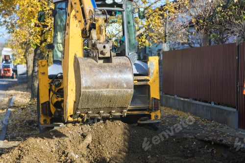 Preview: Excavators during landscaping works at road works construction site