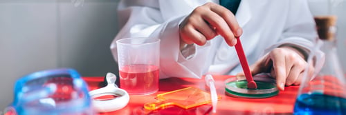 Preview: Boy hands playing to be chemist with colorful liquids