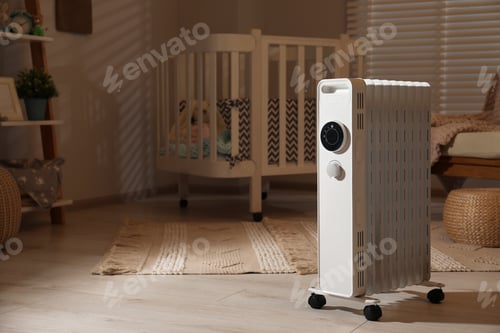 Preview: Modern portable electric heater in child room, space for text