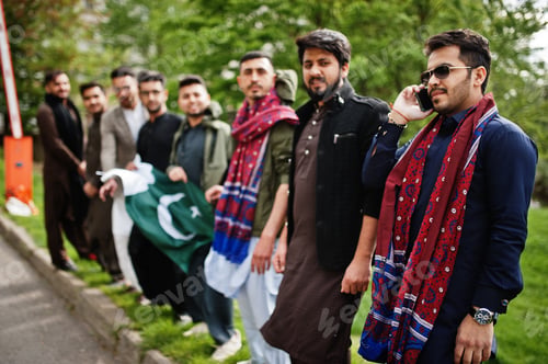 Preview: Group of pakistani man wearing traditional clothes salwar kameez or kurta with Pakistan flags.