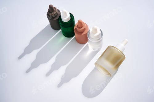 Preview: Skincare serum dropper bottles in minimalist shadow display