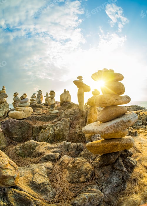 Preview: Stones pyramid on sand symbolizing zen, harmony, balance in Khao Lak Thailand