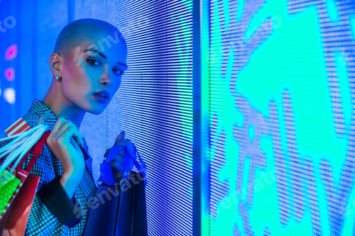 Preview: Beautiful woman illuminated by led lights