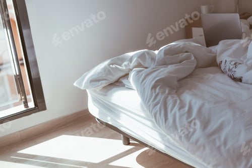 Preview: Working home isolation concept. Laptop in bed