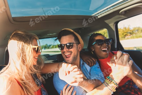 Preview: Three best friends enjoying traveling in the car.