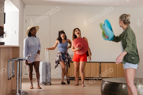 Preview: Friends arriving at vacation rental, excitedly greeting each other with beach gear