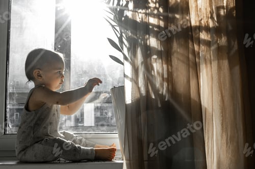 Preview: The baby sits on the windowsill and scatters the ground from flower pots