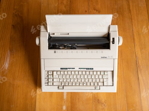 Preview: Antique electronic typewriter on a wood desk