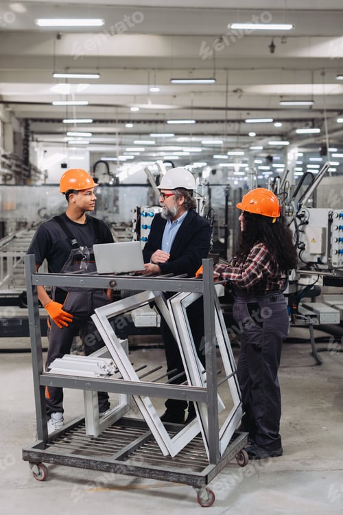 Preview: Workers discussing window production in pvc factory