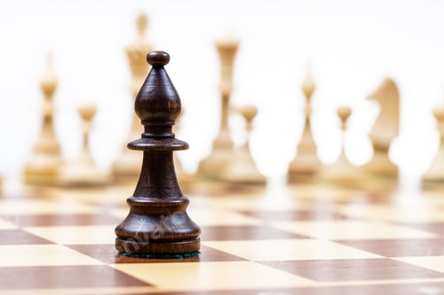 Preview: bishop against white chess figures in background