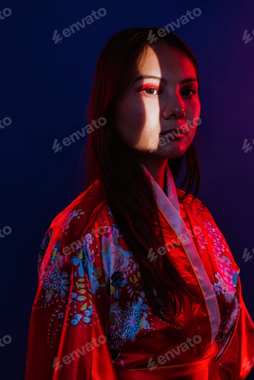 Preview: Asian woman wearing traditional kimono with red light