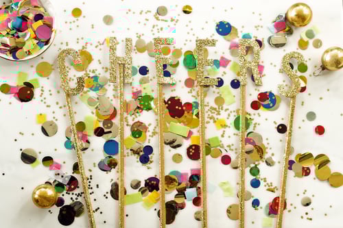 Preview: Party scene with confetti, ornaments and Cheers spelled out