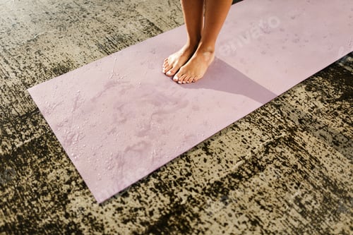 Preview: Bare Feet on a Wet Yoga Mat Indoors