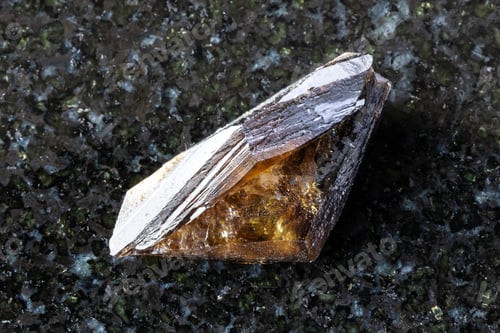 Preview: sample of raw twinned titanite crystal on black