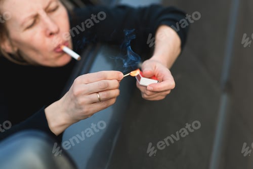 Preview: Mature adult woman smoking