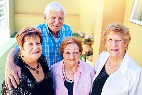Preview: Shot of a group cheerful elderly people smiling and posing for the camera outside of a building