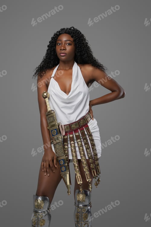 Preview: Woman warrior wearing tunic posing against gray background