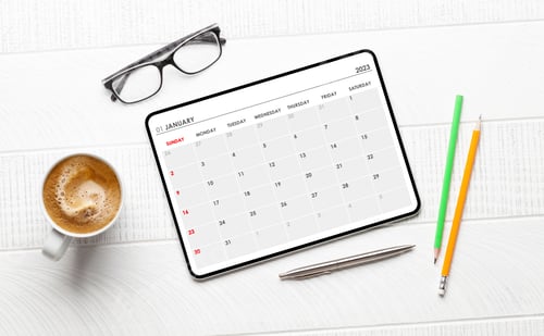 Preview: Tablet with calendar app, coffee cup and office supplies