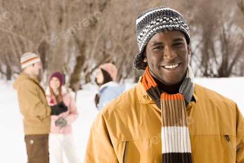 Preview: Four people outdors in hats, coats and scarves.