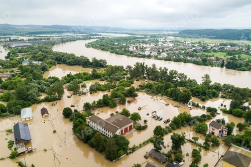 Preview: Aerial view of flooded houses with dirty water of Dnister river in Halych town, western Ukraine.