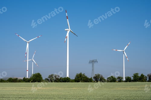 Preview: Wind Turbines Standing Tall in Green Field