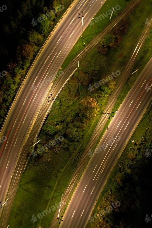 Preview: Top down view to road. Romantic night aerial photo of cars traveling. The light on the road at night