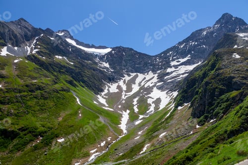 Preview: Panoramic view of green alpine meadows and mountains
