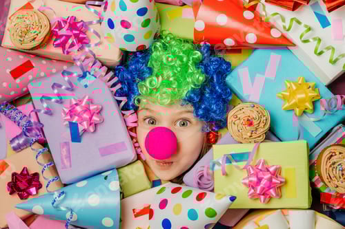 Preview: Little girl lying under plenty of present boxes