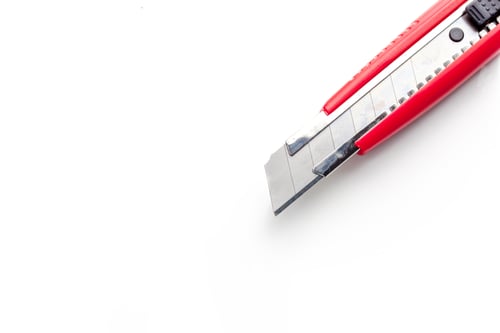 Preview: Red paper knife isolated on white background