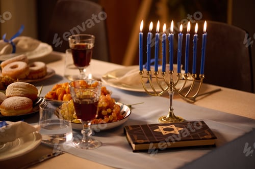 Preview: Lit Candles and Torah on Table