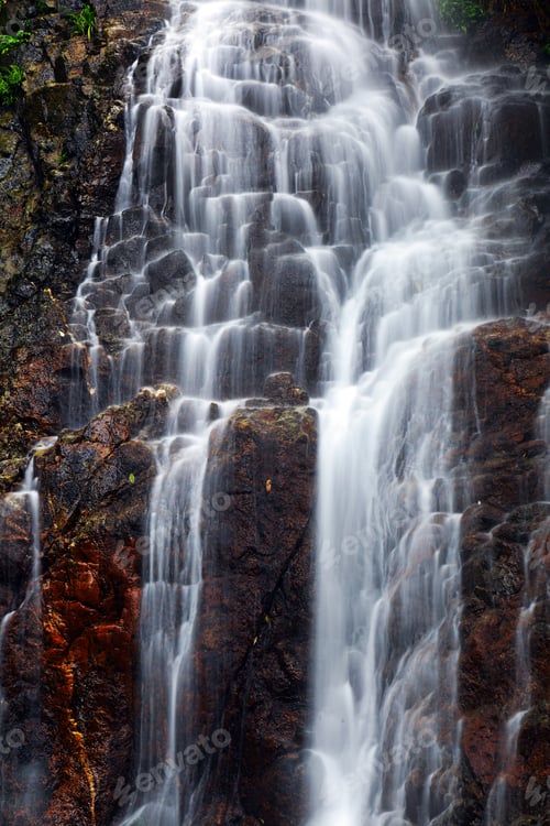 Preview: Beautiful Waterfall Flowing Over Rocks in Nature