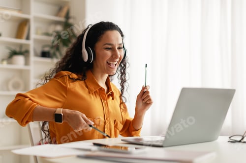 Preview: Middle Eastern Woman Listening Music Using Laptop Having Fun Indoors