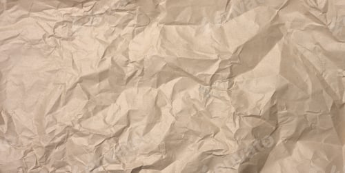 Preview: Crumpled blank sheet of brown wrapping kraft paper, vintage texture for the designer