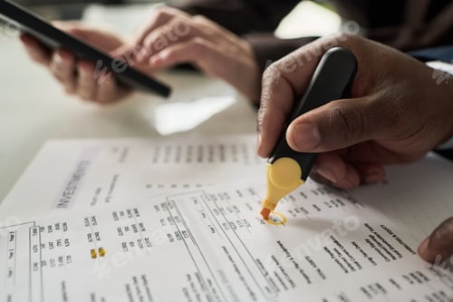 Preview: Businessman Noting Data On Document