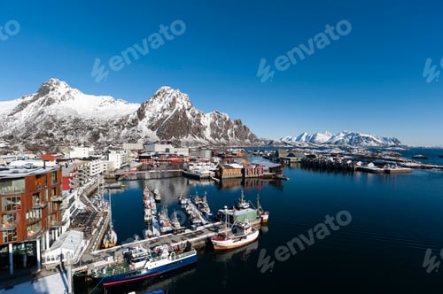 Preview: Elevated view of harbour and snow capped mountains, Svolvaer, Lofoten Islands, Norway