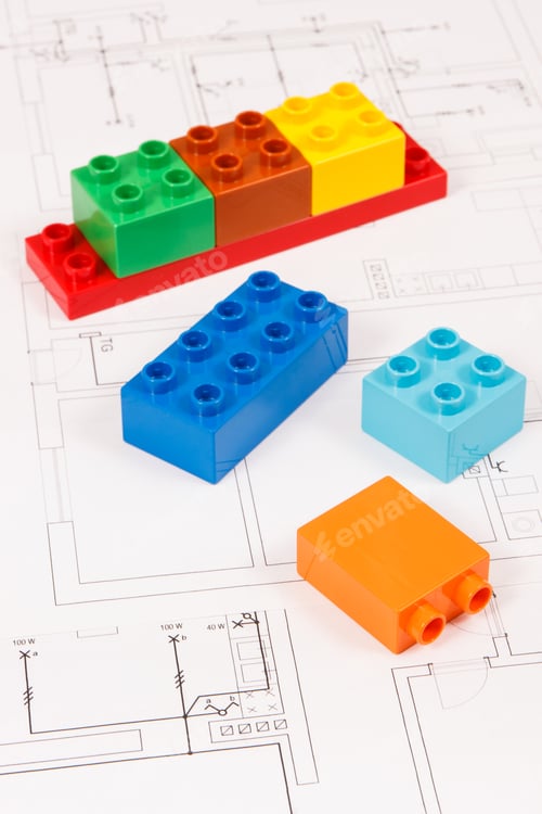 Preview: Colorful toy blocks and construction drawings of house. Building, buying or renting home concept