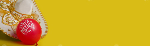 Preview: Mexican mariachi hat and balloons with text Viva Mexico, yellow background.