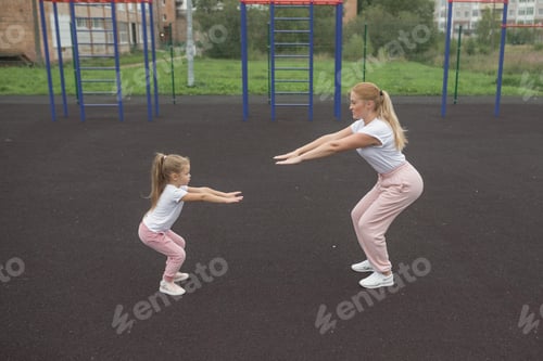 Preview: Adult and Child Exercising Outdoors on a Cloudy Day