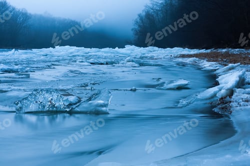 Preview: Frozen winter in unspoiled nature with ice on riverbanks