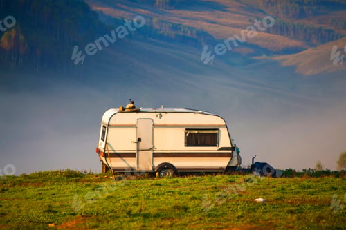 Preview: Old trailer in the middle of spring field