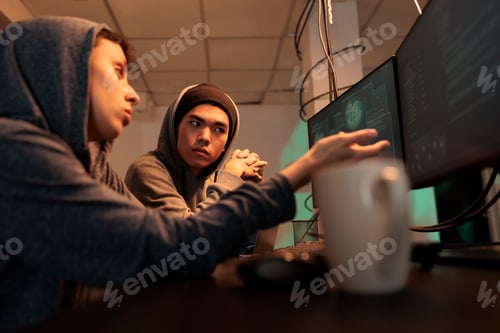 Preview: Hackers planning cyberattack, discussing malicious software code