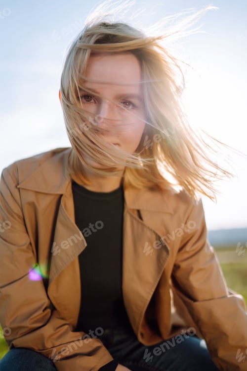 Preview: Young woman enjoys a spring sunny day. People, lifestyle, travel, nature and vacations concept.