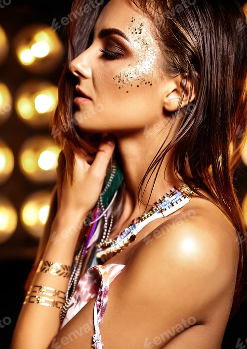 Preview: Portrait of young brunette woman posing in studio