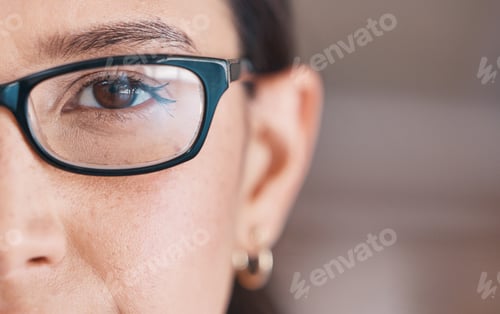 Preview: Closeup of the eye of a woman wearing glasses. Eye of a woman going for an optometry visit. Portrai