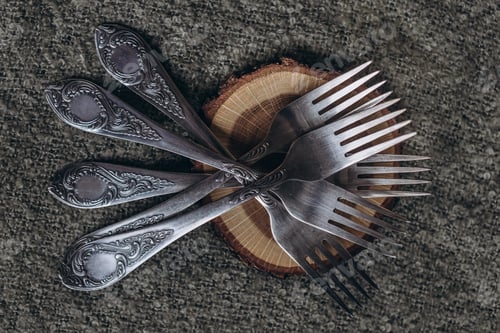 Preview: set of silver forks on the table