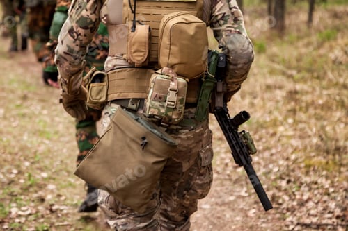 Preview: American soldiers men gone on road military camouflage uniform with weapon in forest at nature