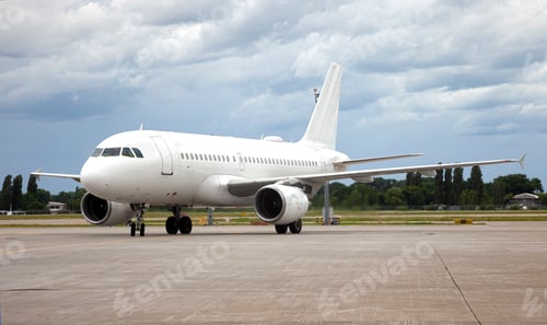 Preview: Passanger white plane lands. Blue airplane on the platform of Airport. Runway. Landing aircraft