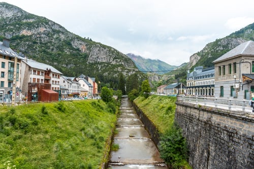 Preview: View of the old train station of Canfranc in the Aragonese Pyrenees next to the river. Spain